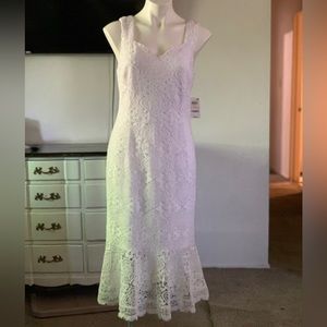 All white dress with floral lace. Brand new with tag.